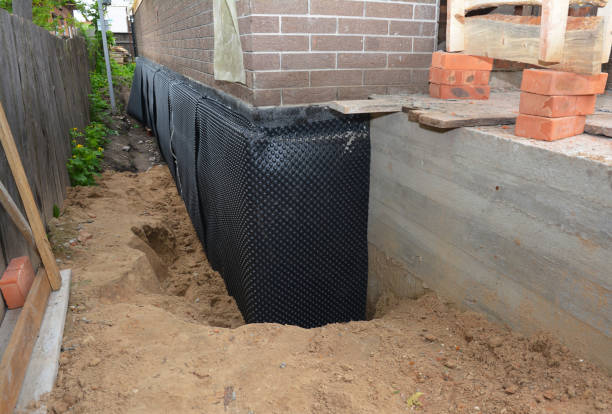 Happy homeowners after waterproofing job in Greenwood